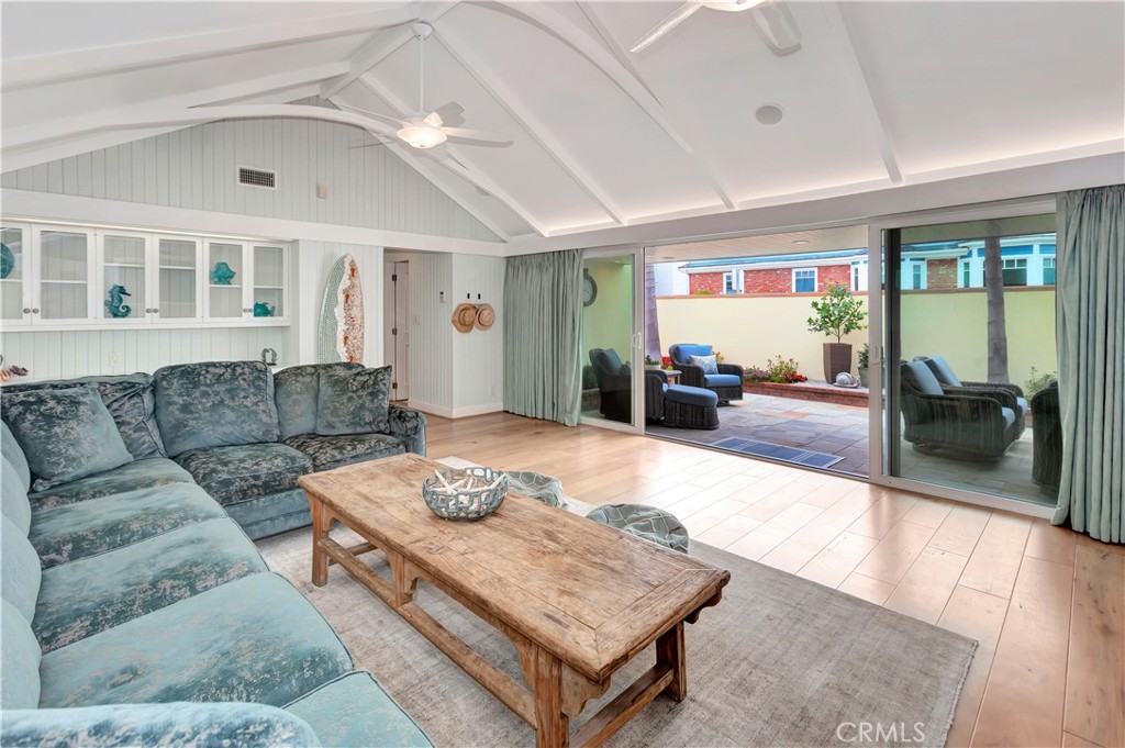 1102 West Oceanfront Newport Beach, CA 92661 - Photo 14 of 32 a living room with furniture and a flat screen tv