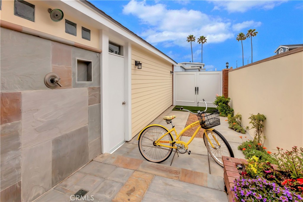 1102 West Oceanfront Newport Beach, CA 92661 - Photo 16 of 32 a view of a porch with a potted plant