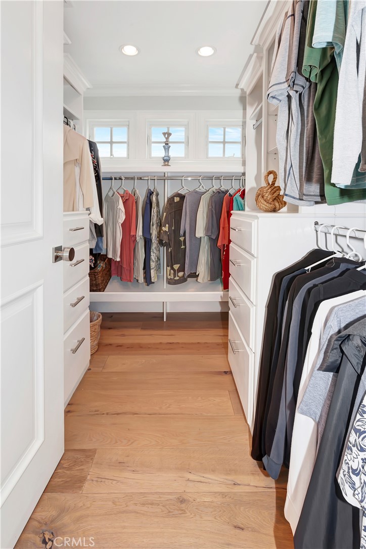 1102 West Oceanfront Newport Beach, CA 92661 - Photo 20 of 32 a view of walk in closet with clothes and shoes