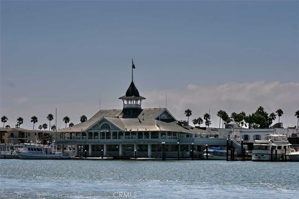 1102 West Oceanfront Newport Beach, CA 92661 - Photo 31 of 32 a view of a big house with a big yard and large trees