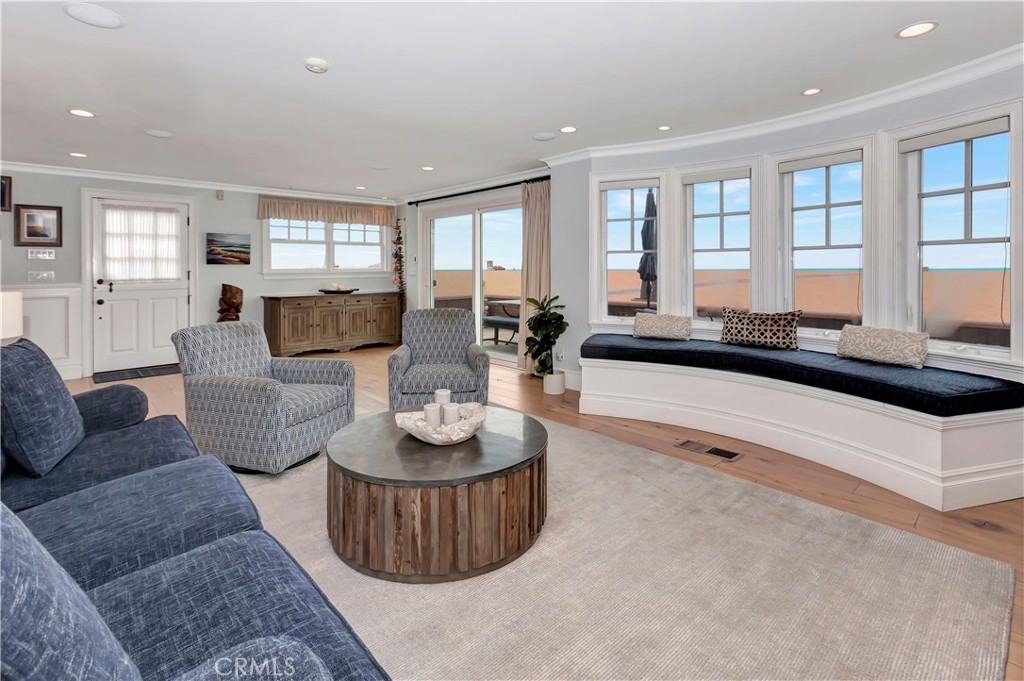 1102 West Oceanfront Newport Beach, CA 92661 - Photo 8 of 32 a living room with furniture and wooden floor
