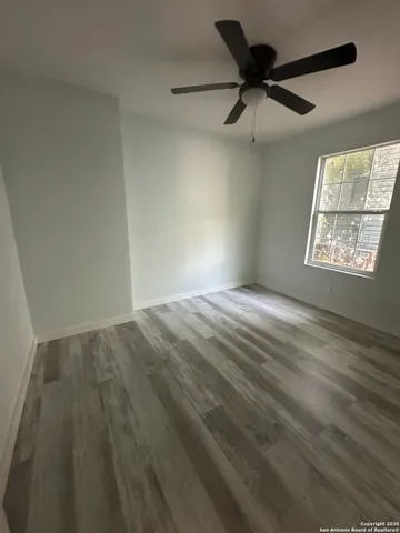 a view of a house with yard and a tree