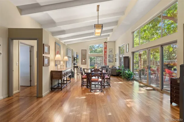 a view of a livingroom with furniture window and wooden floor