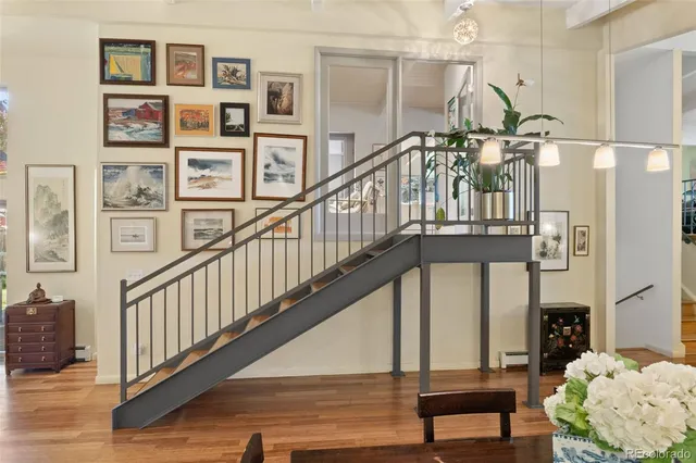a view of entryway and hall with wooden floor
