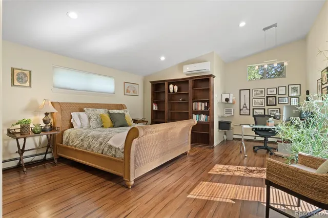 a bed room with a bed and a desk