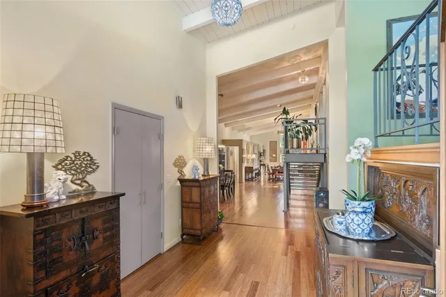 a dining room with furniture and wooden floor
