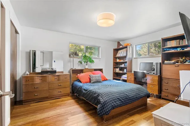 a bedroom with a bed and dresser