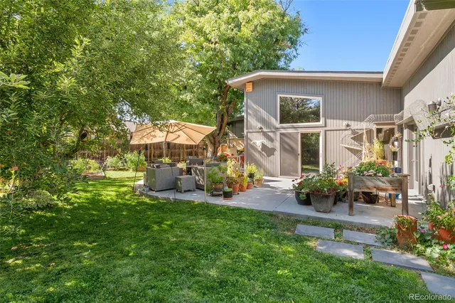 a front view of a house with sitting area