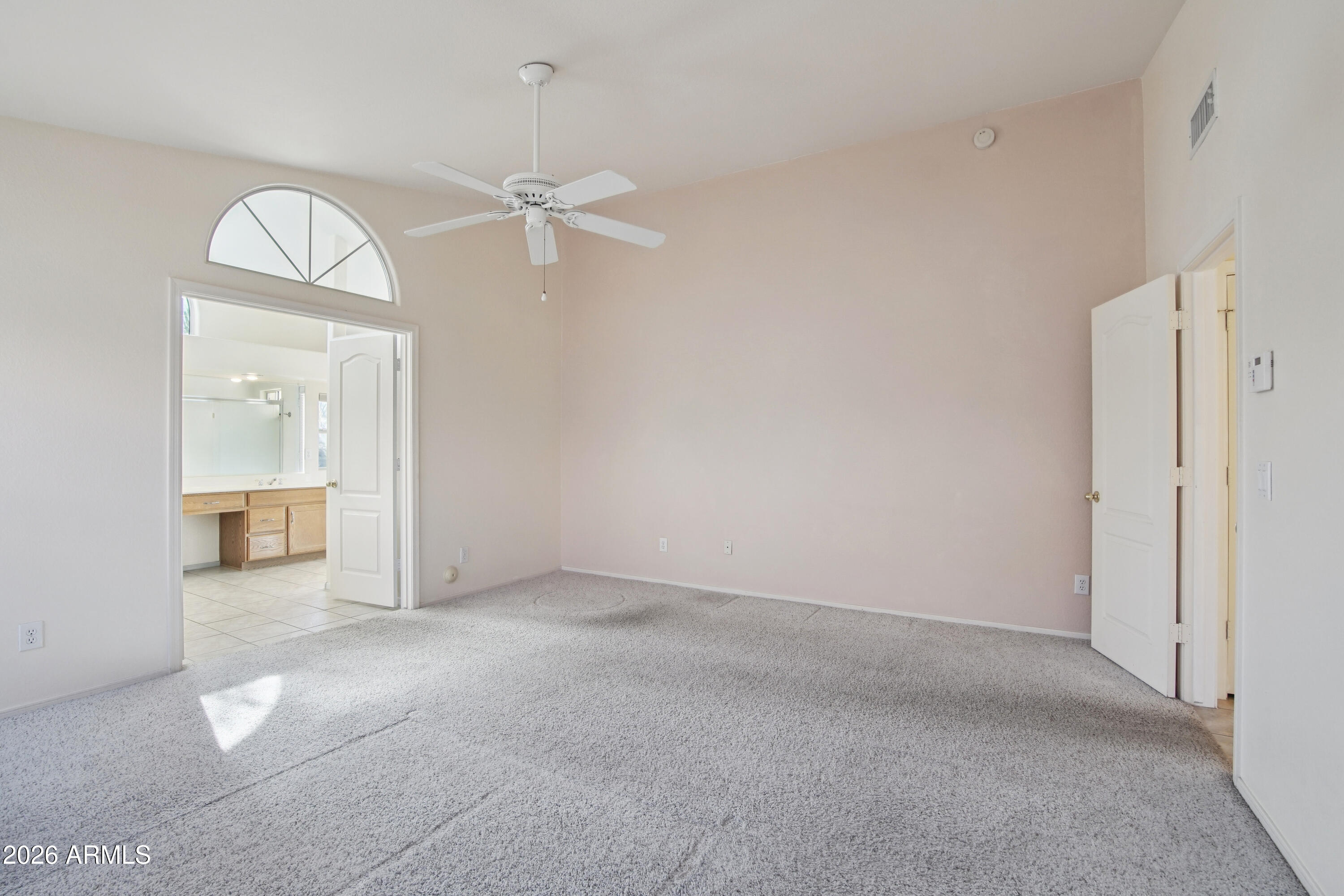 9729 West Burnett Road Peoria, AZ 85382 - Photo 13 of 29 an empty room with a bathroom