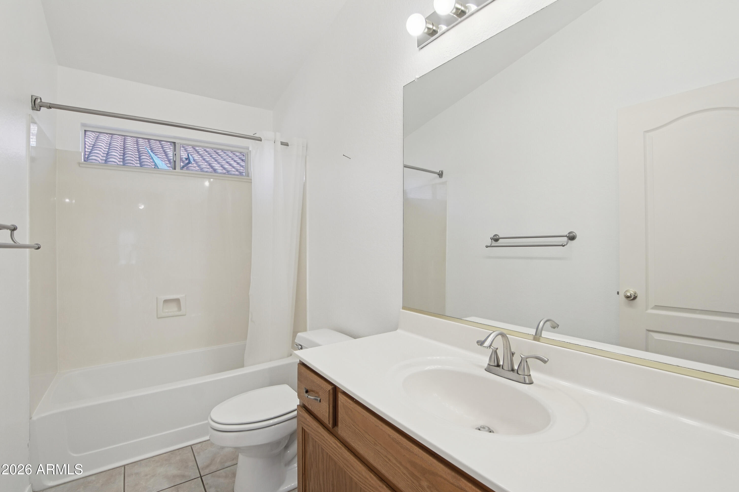 9729 West Burnett Road Peoria, AZ 85382 - Photo 17 of 29 a bathroom with a sink toilet and shower