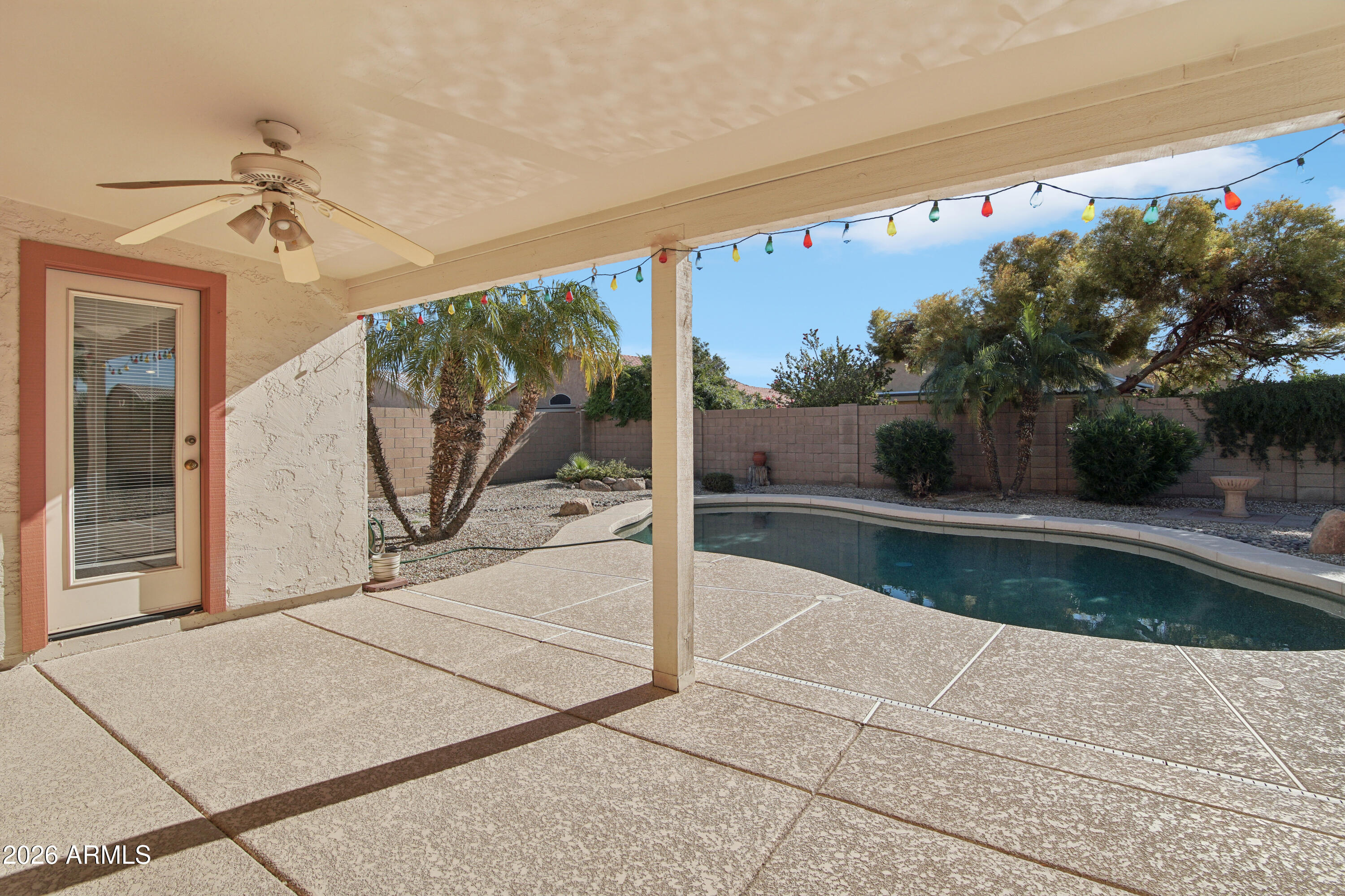 9729 West Burnett Road Peoria, AZ 85382 - Photo 24 of 29 a view of a living room and a floor to ceiling window