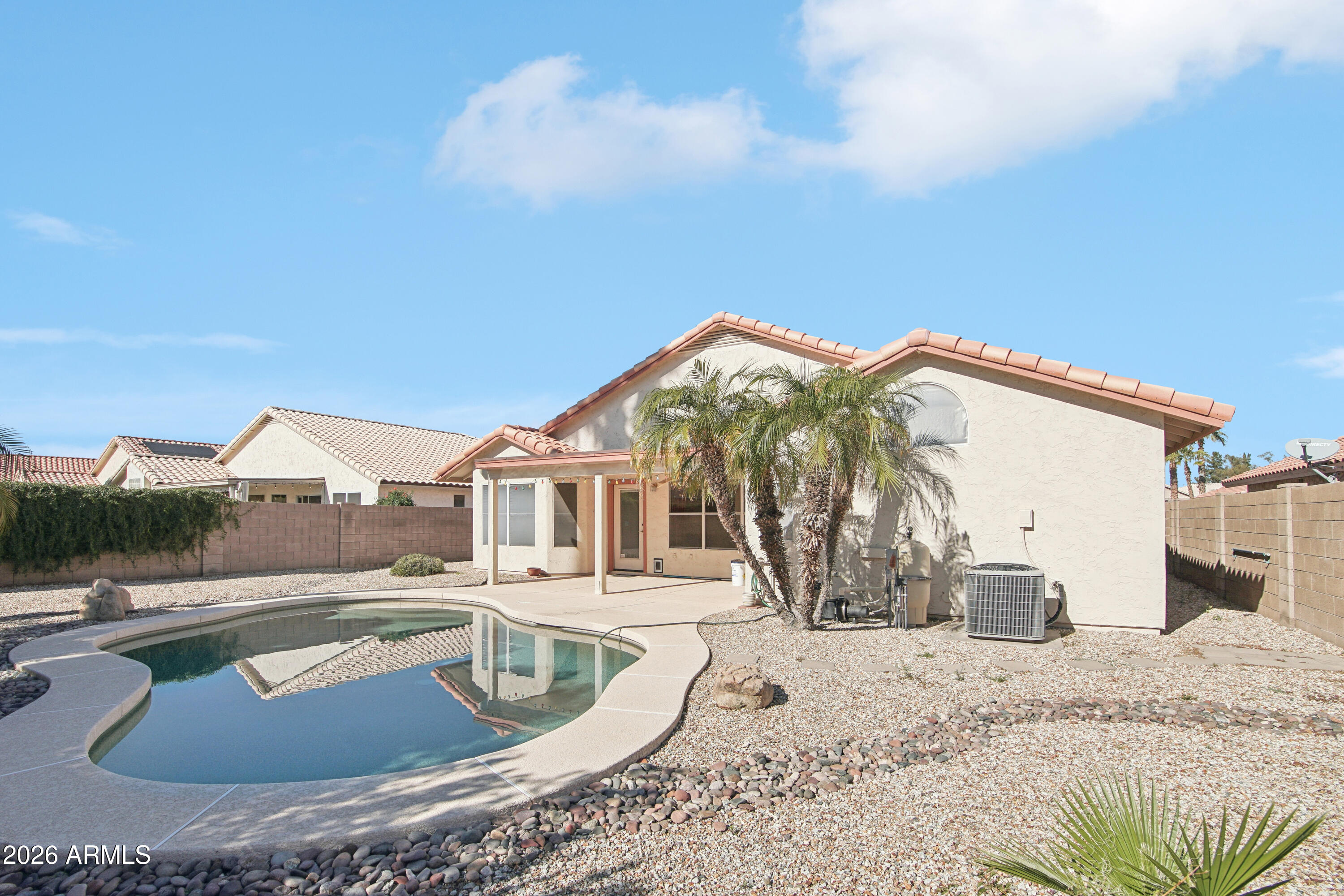 9729 West Burnett Road Peoria, AZ 85382 - Photo 27 of 29 a view of a house with a swimming pool