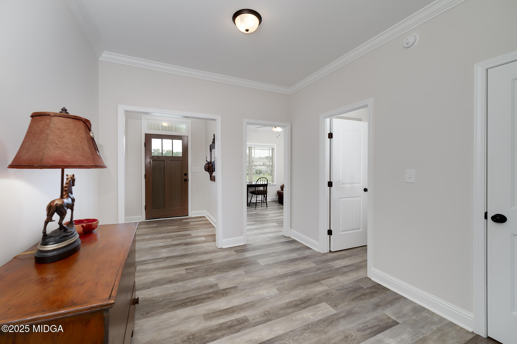 519 Barbara Court Forsyth, GA 31029 - Photo 11 of 39 a view of a livingroom with wooden floor and a flat screen tv