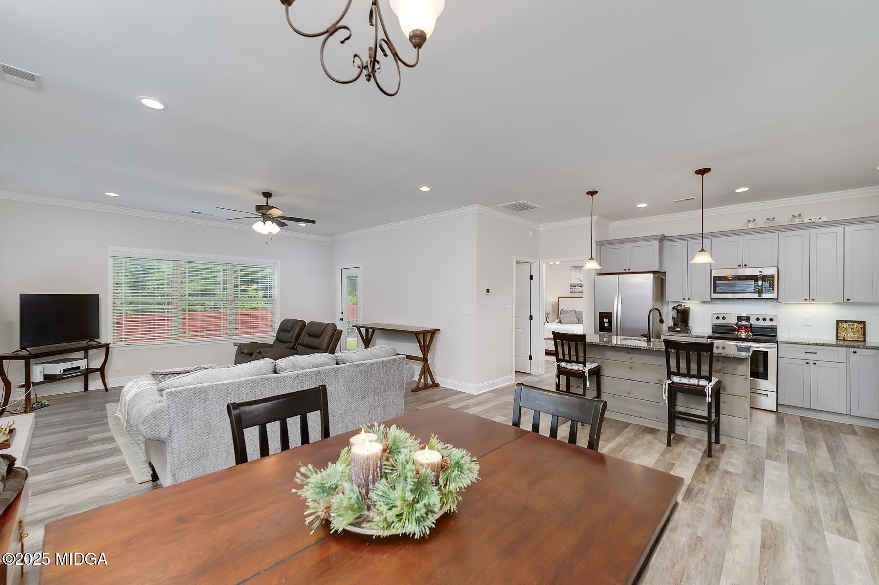 519 Barbara Court Forsyth, GA 31029 - Photo 14 of 39 a large kitchen with a table and chairs in it
