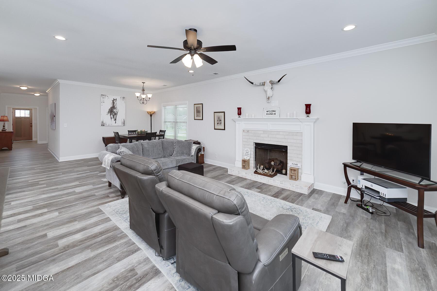 519 Barbara Court Forsyth, GA 31029 - Photo 22 of 39 a living room with furniture a flat screen tv and a fireplace