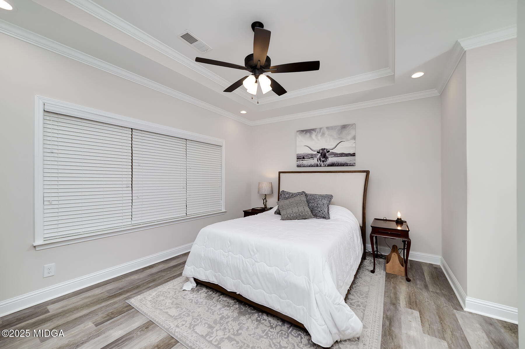 519 Barbara Court Forsyth, GA 31029 - Photo 26 of 39 a bedroom with a bed and a chandelier