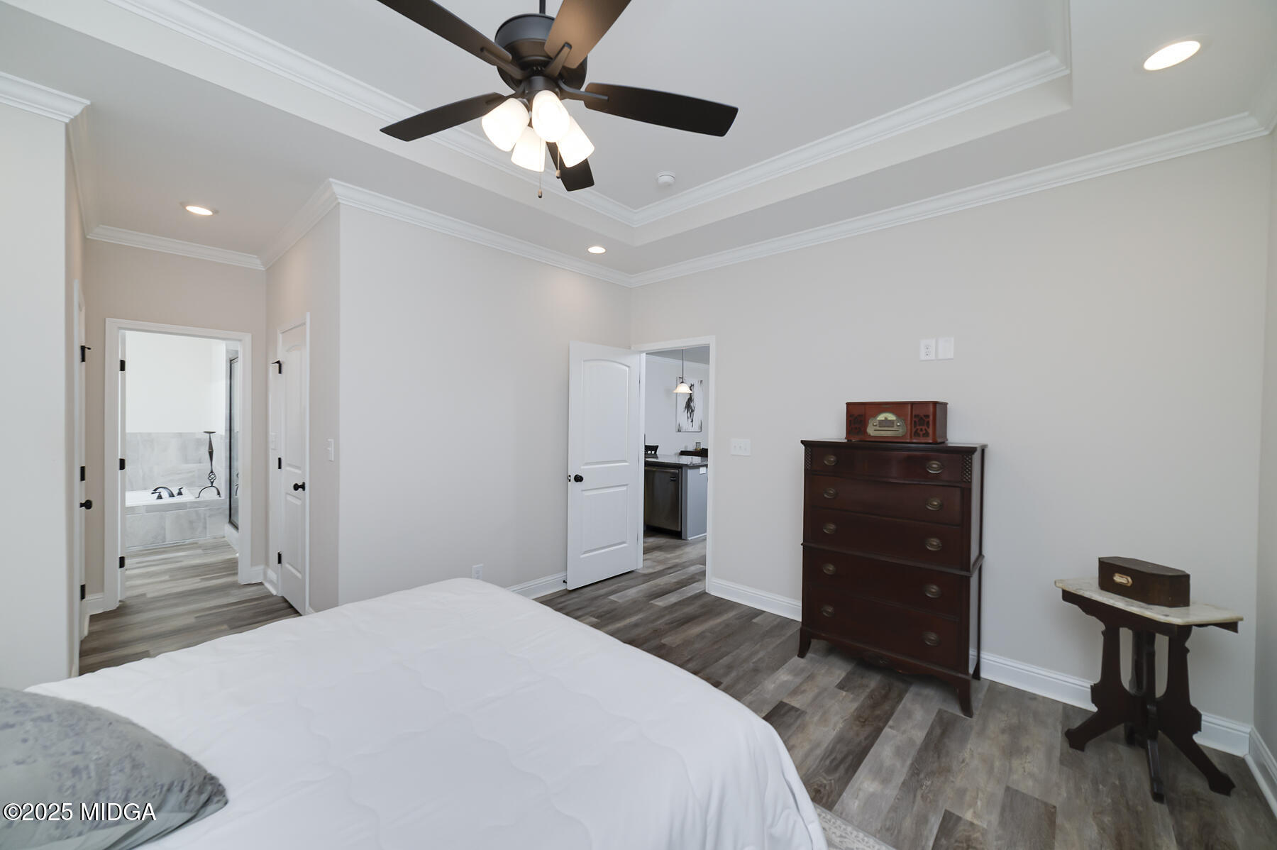 519 Barbara Court Forsyth, GA 31029 - Photo 27 of 39 a bedroom with a bed and a chandelier