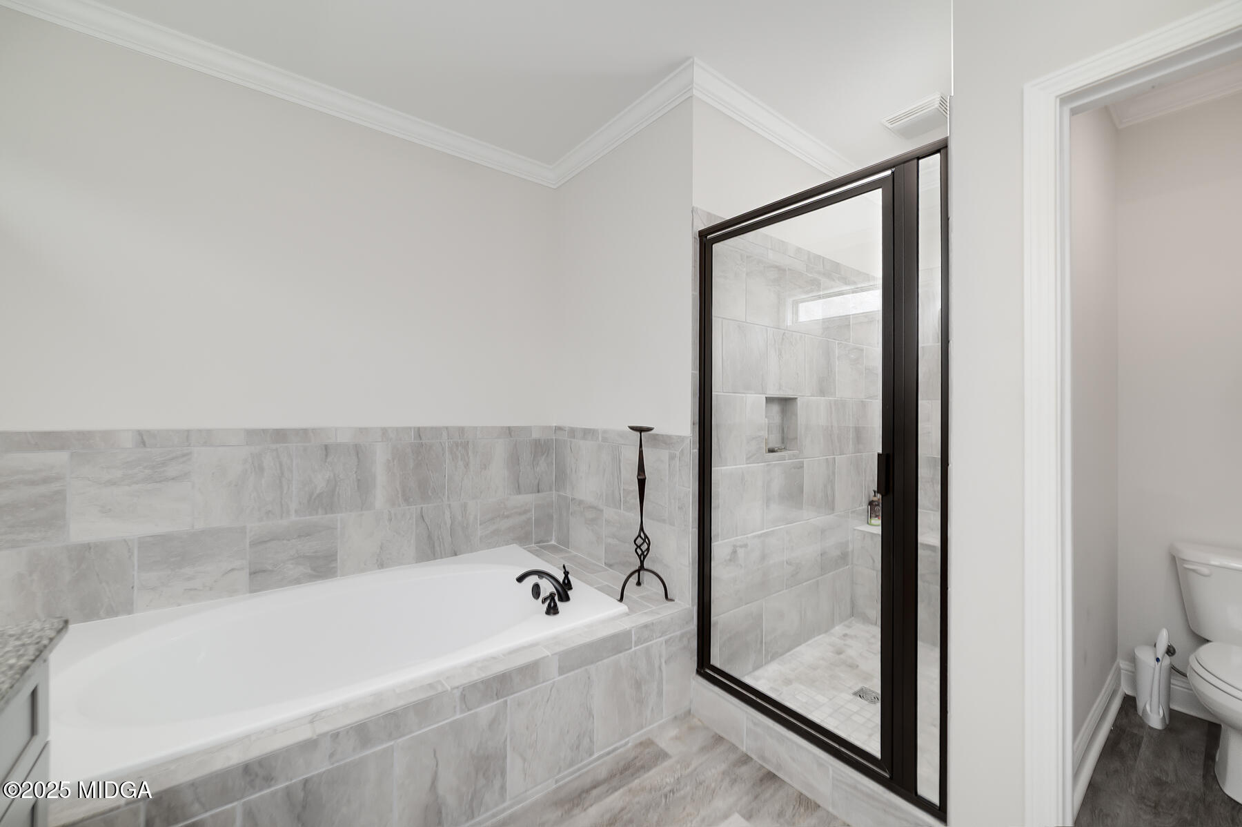 519 Barbara Court Forsyth, GA 31029 - Photo 28 of 39 a bathroom with a bathtub and shower