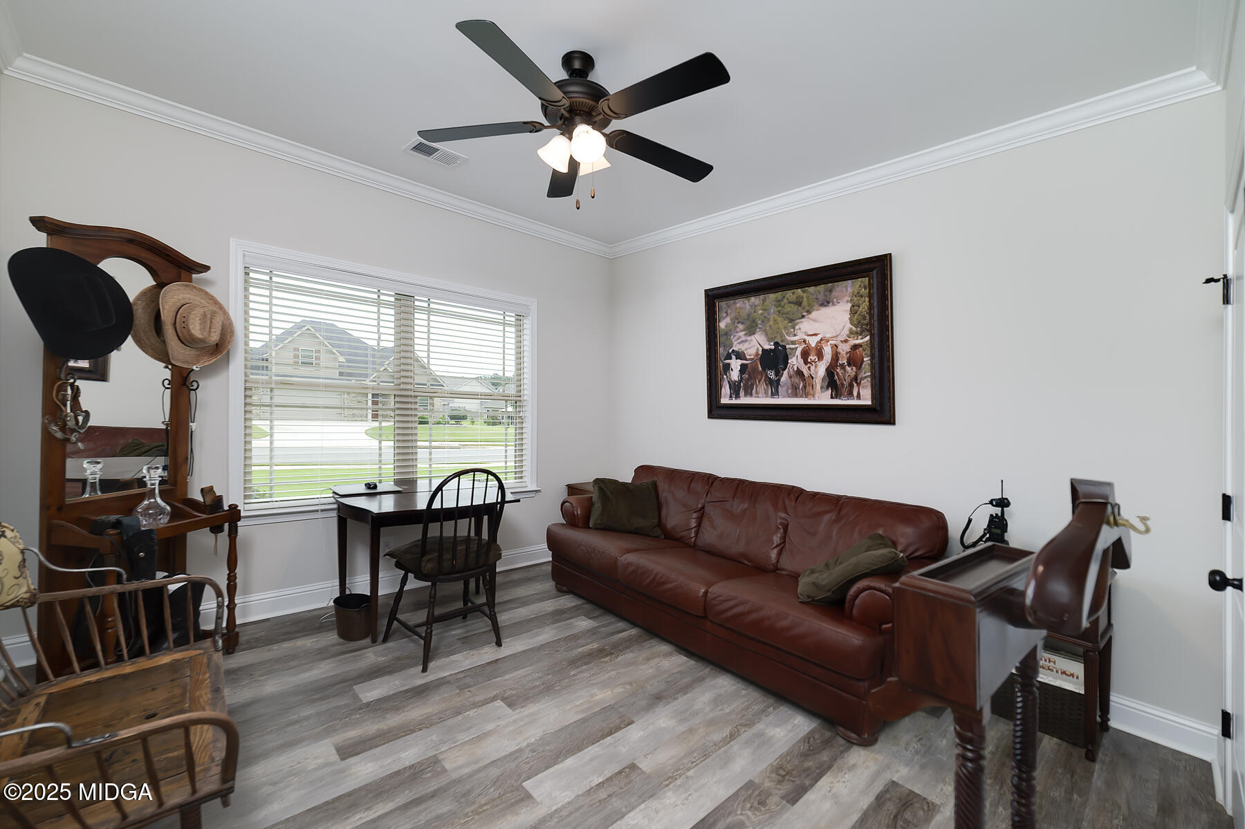 519 Barbara Court Forsyth, GA 31029 - Photo 30 of 39 a living room with furniture two window and wooden floor