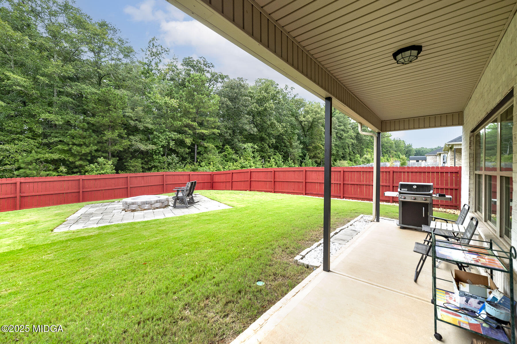 519 Barbara Court Forsyth, GA 31029 - Photo 5 of 39 a view of yard with deck and garden