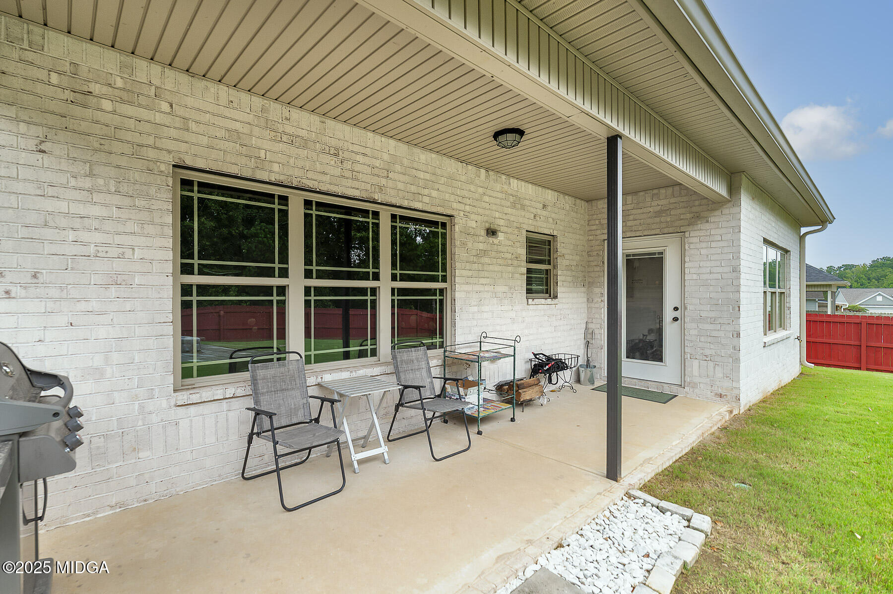 519 Barbara Court Forsyth, GA 31029 - Photo 9 of 39 a building outdoor space with couple of chairs and couch