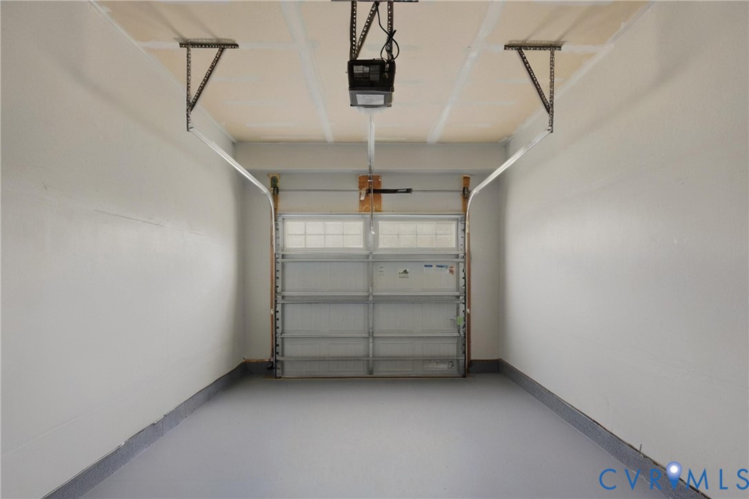 4120 Jefferson Rdg Drive Midlothian, VA 23112 - Photo 16 of 19 Enclosed garage featuring a gray epoxy floor finis