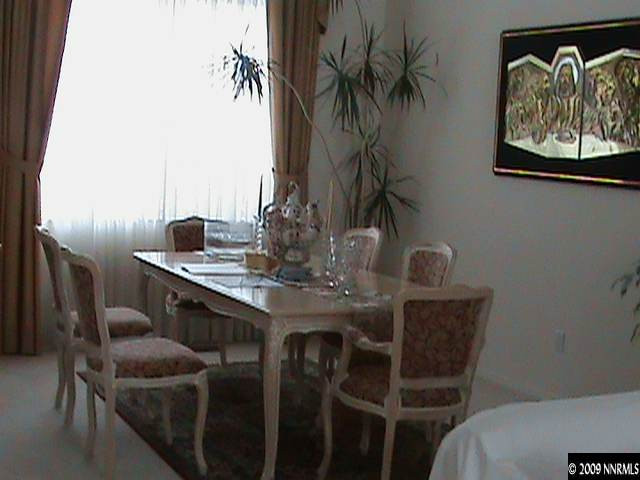 4559 Goodwin Road Sparks, NV 89436 - Photo 3 of 9 a dining room with furniture and wooden floor
