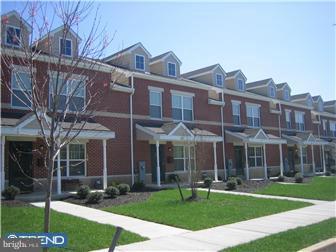 1605 West 7th Street Chester, PA 19013 - Photo 1 of 11 front view of a building with a yard