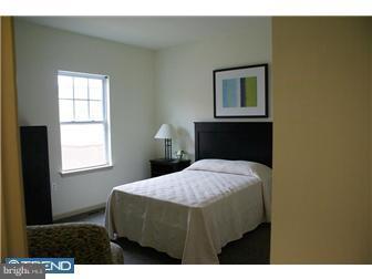 1605 West 7th Street Chester, PA 19013 - Photo 7 of 11 a bedroom with a bed and a window