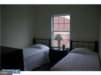 1605 West 7th Street Chester, PA 19013 - Photo 9 of 11 a bedroom with a bed and a window
