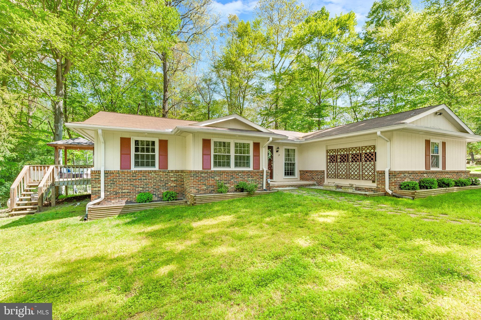 7290 Simms Landing Road Port Tobacco, MD 20677 - Photo 16 of 74 Front house view w/side entrance to deck
