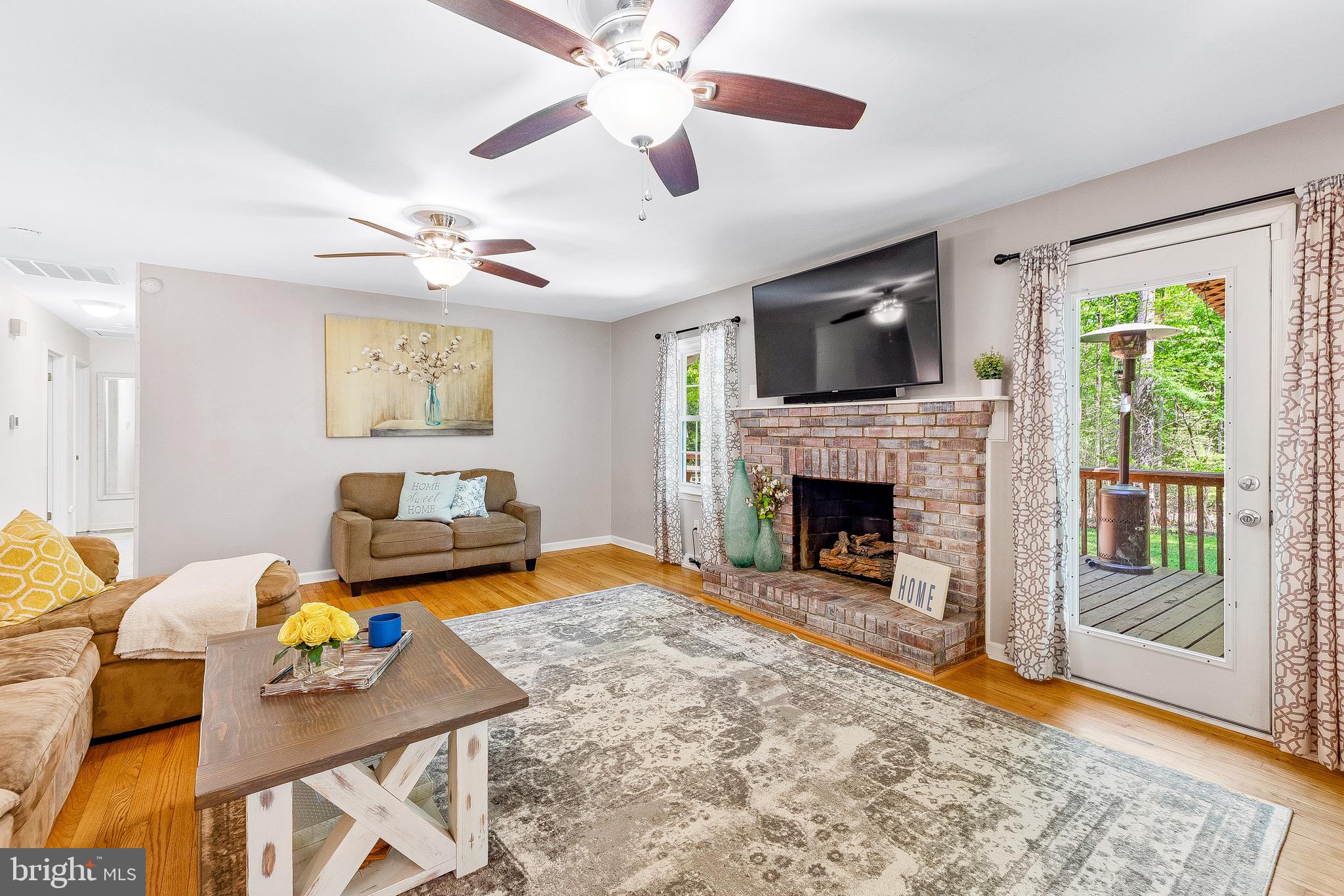 7290 Simms Landing Road Port Tobacco, MD 20677 - Photo 3 of 74 Family Room w/hardwood & gas brick fireplace