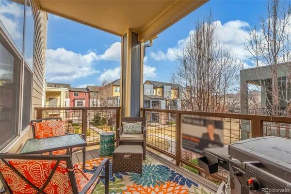 a balcony view with couple of chairs