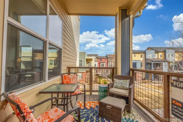 a balcony with furniture and city view