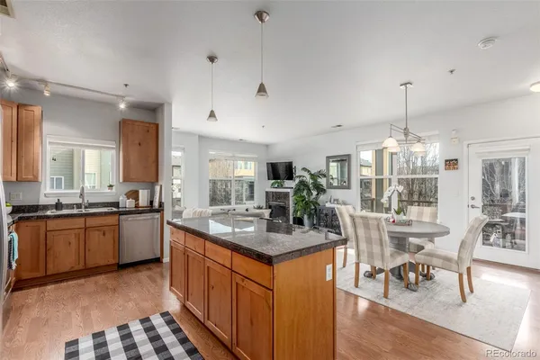 a kitchen with stainless steel appliances granite countertop stove a sink and a refrigerator