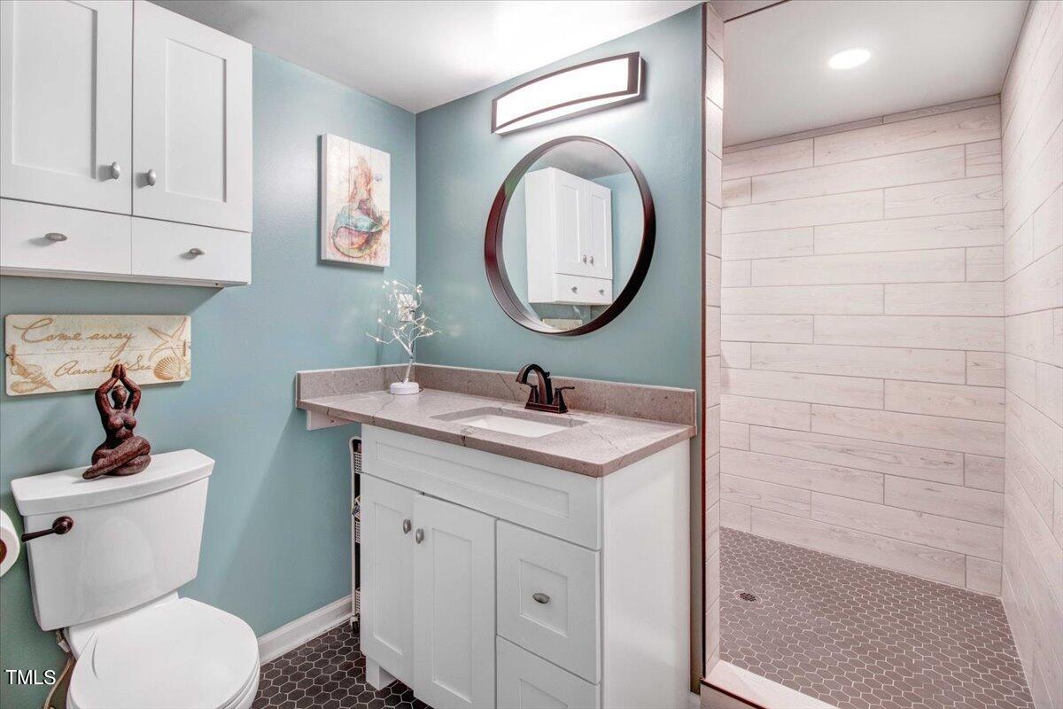 7509 Fiesta Way Raleigh, NC 27615 - Photo 20 of 56 primary walk in shower/bathroom