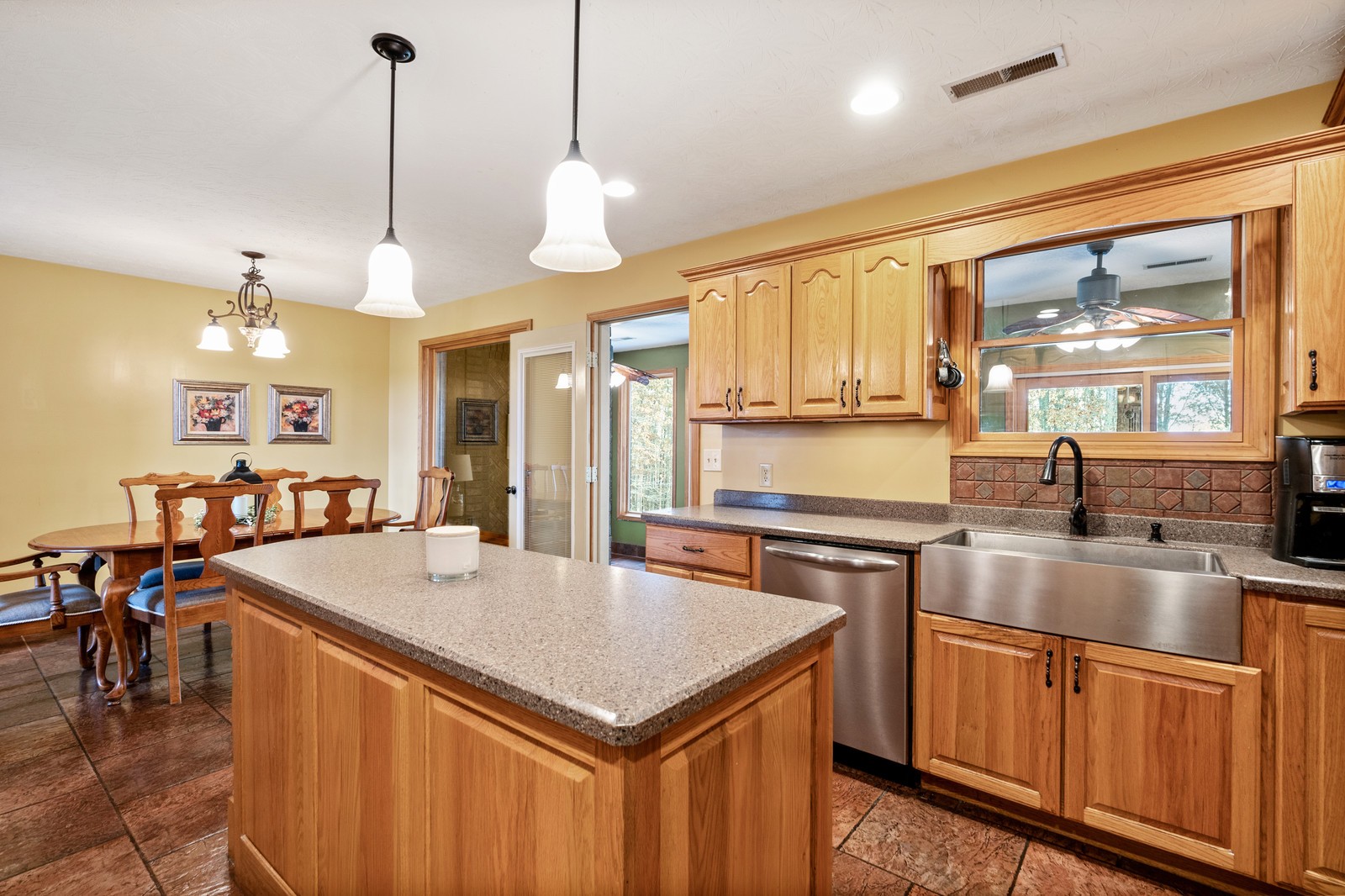 340 Lear Road Portland, TN 37148 - Photo 7 of 26 a kitchen with stainless steel appliances granite countertop a sink a stove and a wooden floors