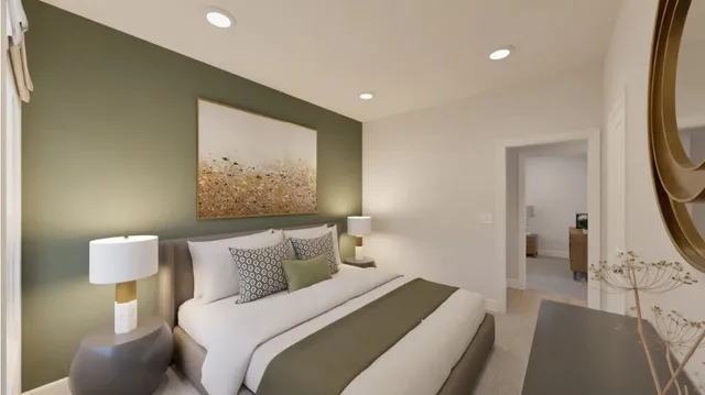 a bedroom with a bed and a couch