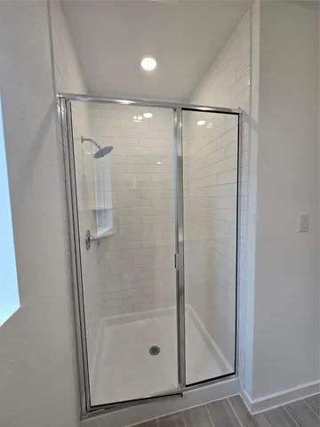 a bathroom with 2 sink and a mirror