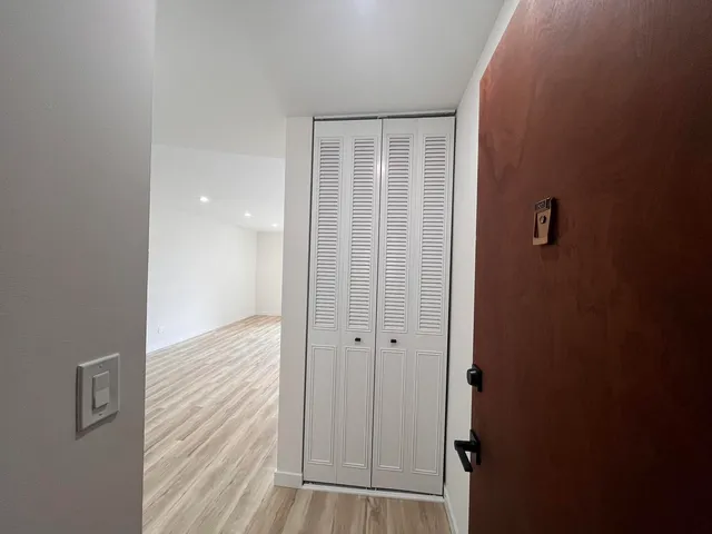 a view of a bathroom with wooden floor