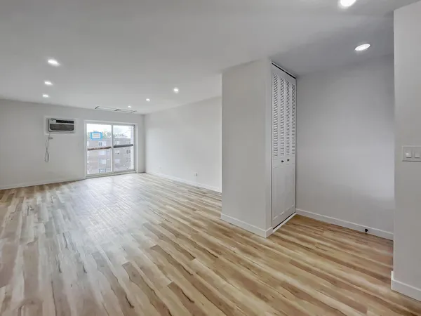 a view of an empty room and window