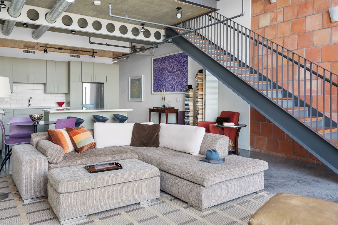 1401 Eva Street, Unit 406 Austin, TX 78704 - Photo 13 of 32 a living room with furniture and a wooden floor