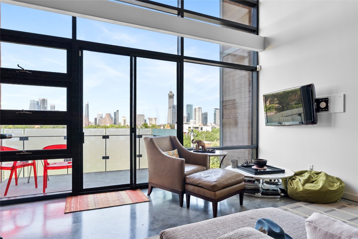 1401 Eva Street, Unit 406 Austin, TX 78704 - Photo 14 of 32 a living room with furniture and a flat screen tv