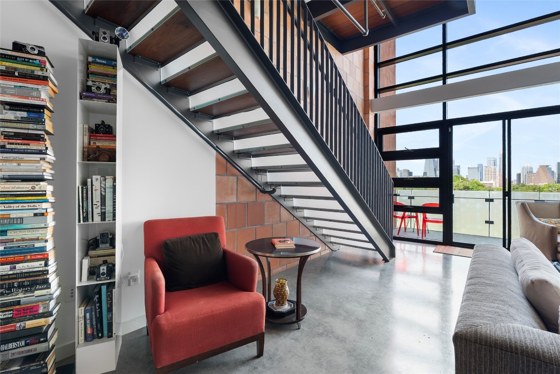 1401 Eva Street, Unit 406 Austin, TX 78704 - Photo 19 of 32 a view of a livingroom with furniture staircase and windows