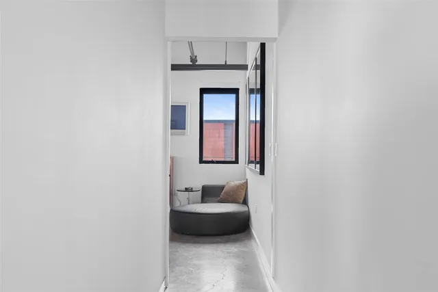 a bedroom with a bed and wall painting