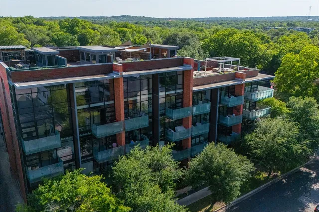 a living room with furniture and a ceiling fan