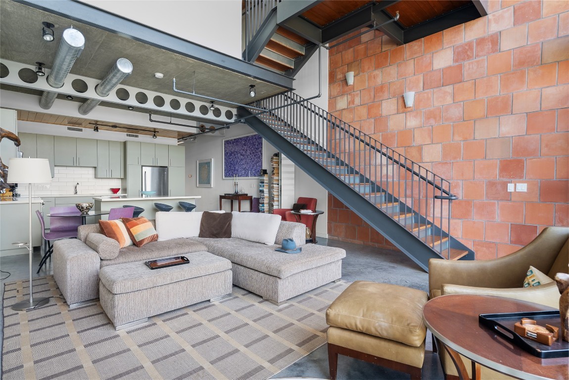 1401 Eva Street, Unit 406 Austin, TX 78704 - Photo 7 of 32 a living room with furniture and a ceiling fan