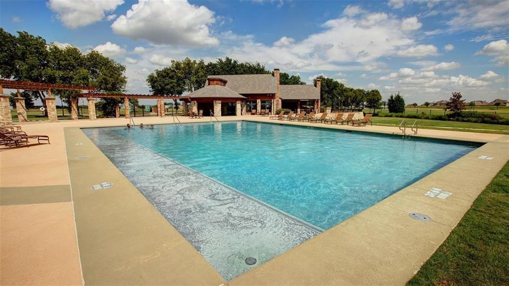 2615 Beckford Drive Forney, TX 75126 - Photo 13 of 16 a view of swimming pool with outdoor seating and garden
