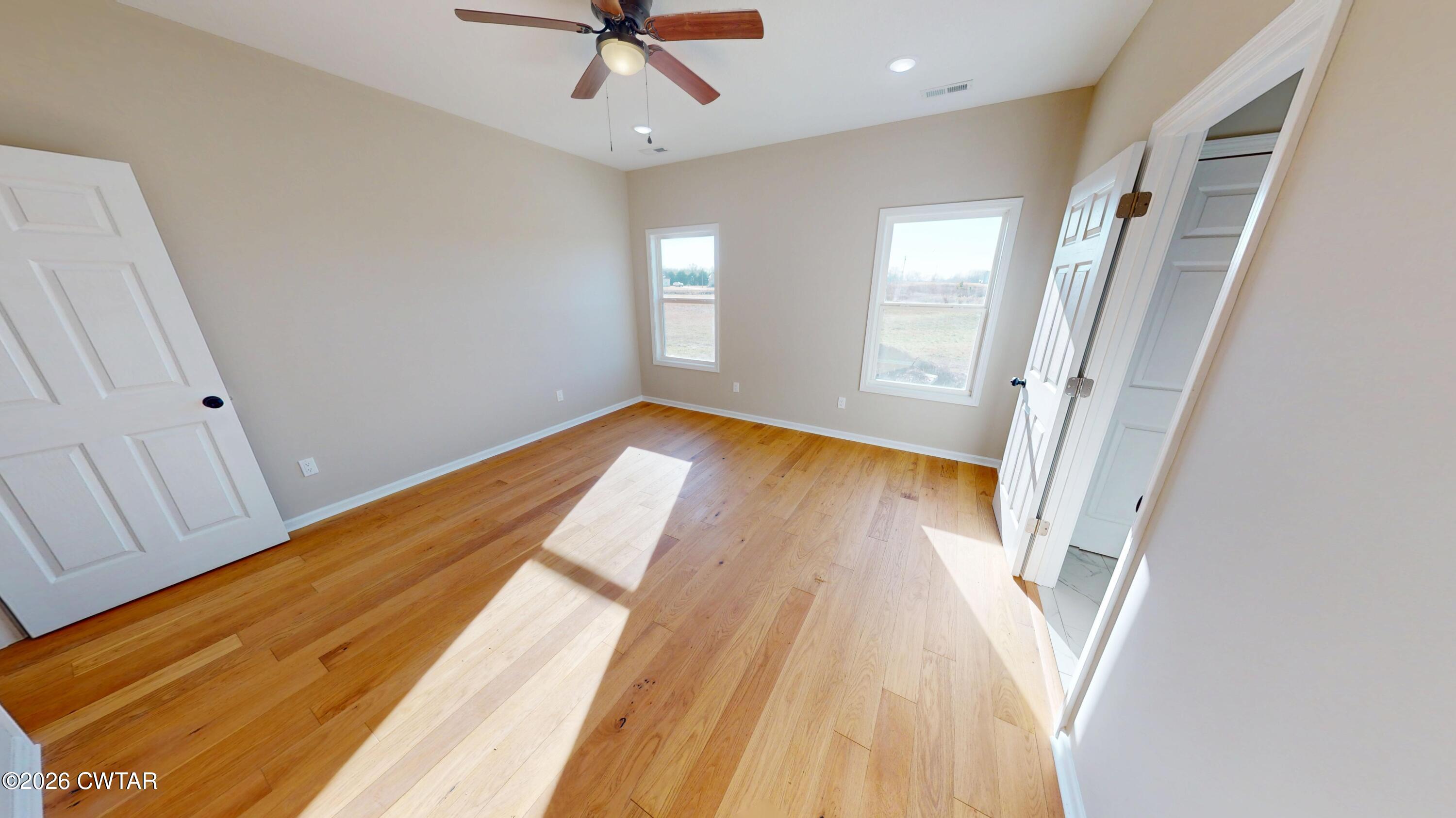 1360 Bonicord Road Dyersburg, TN 38024 - Photo 16 of 31 a view of wooden floor in an empty room