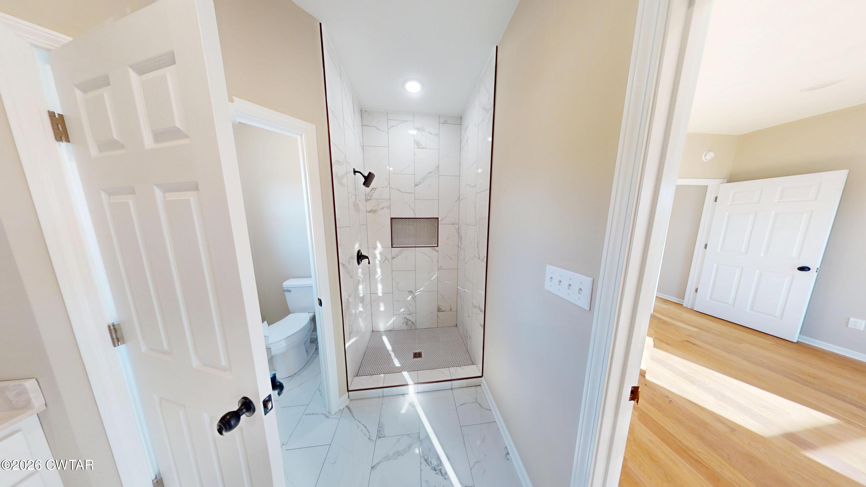 1360 Bonicord Road Dyersburg, TN 38024 - Photo 19 of 31 a bathroom with a shower and a glass door